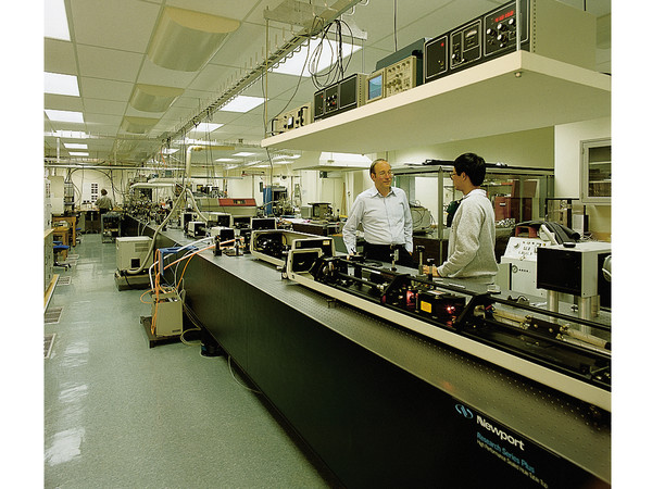 Optical table systems minimize the relative motion of a large array of sensitive scientific and production equipment